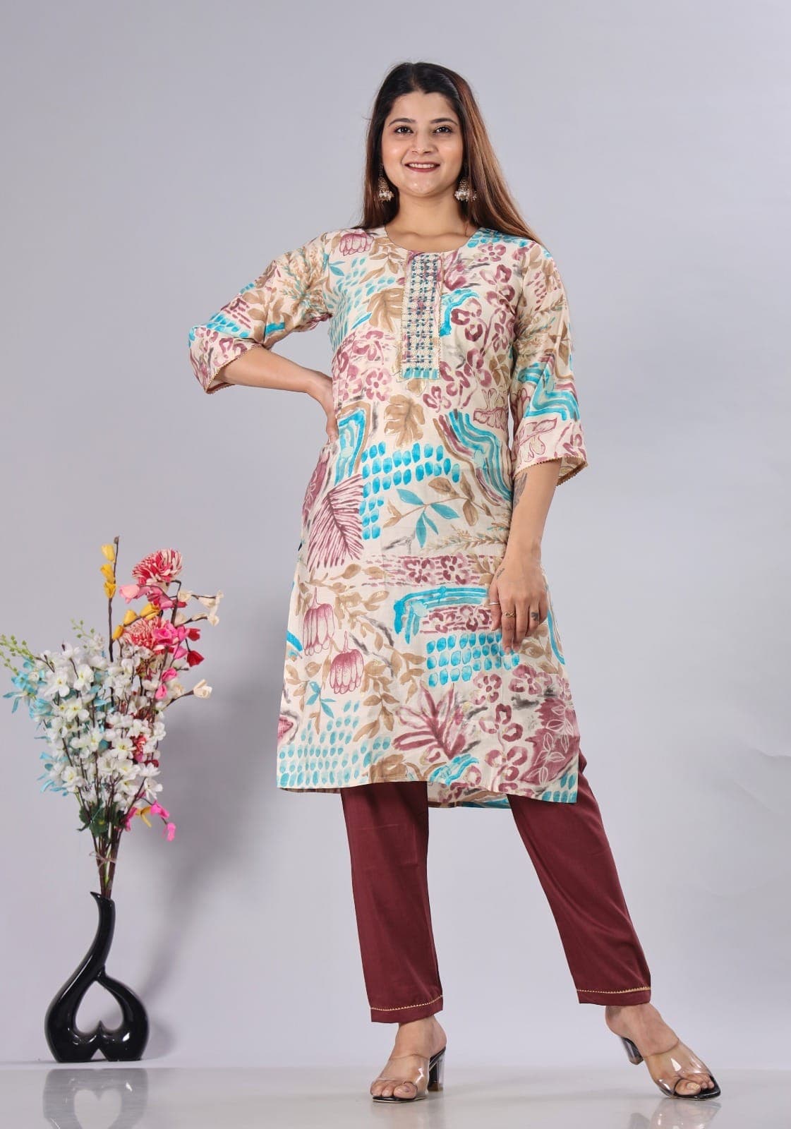 Model wearing a colorful printed kurti from Navya Fashion House